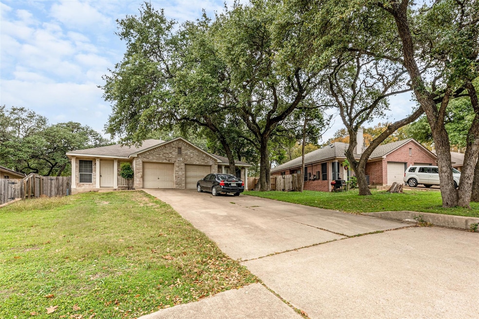 Single story home featuring a garage, fence, conc