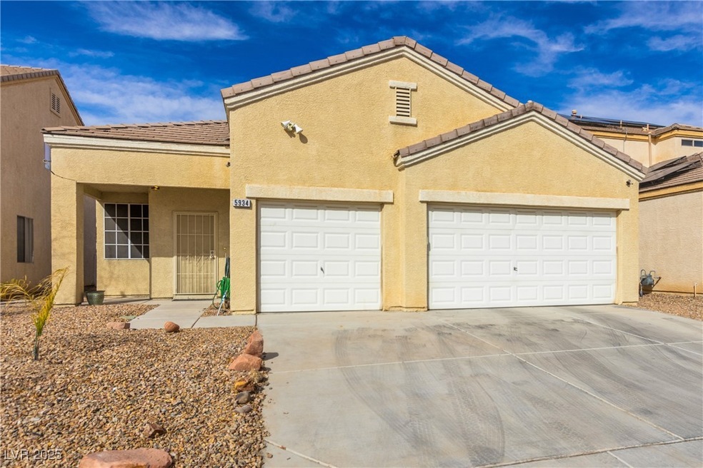 Mediterranean / spanish home with a garage, a tile