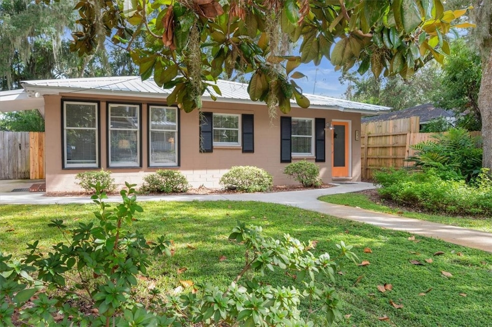 A beautifully landscaped front yard invites you into this original and very charming beach cottage!
