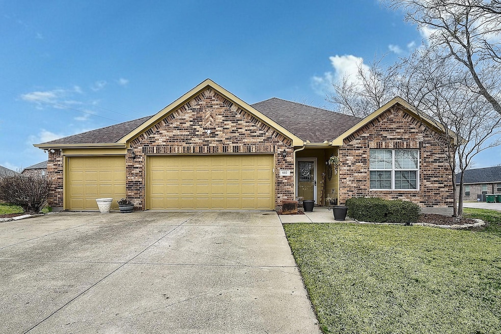 View of front of house featuring a garage and a fr