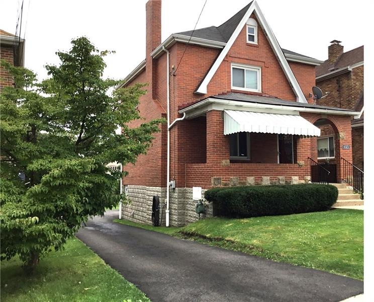 4323 Winterburn Ave, a sturdy brick home on a love