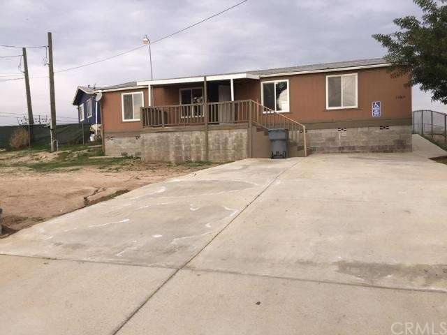 This home not only features a large gated driveway