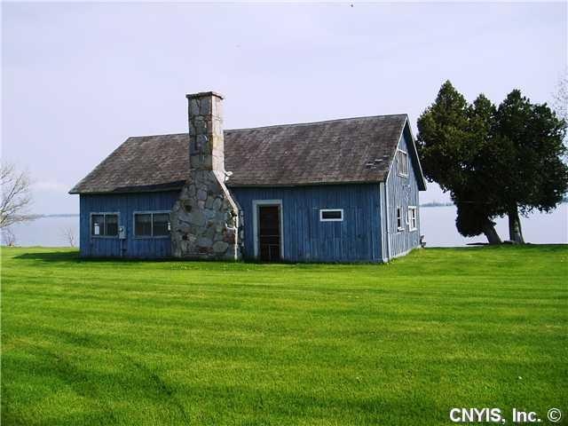 Exterior Front. Superior lot all on the water side