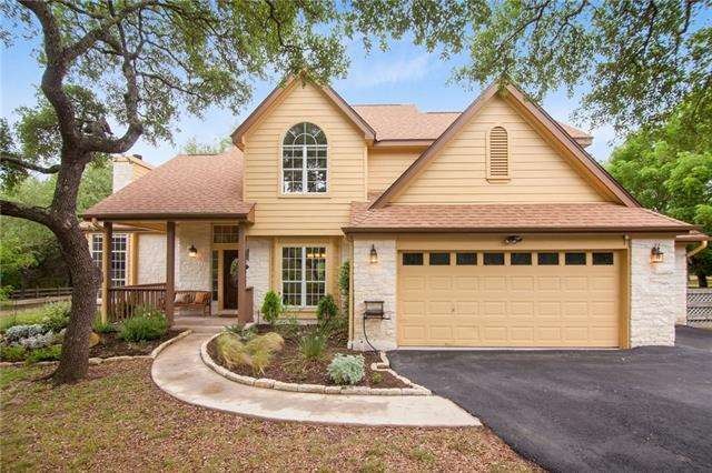 Lovely 4 bedroom home sits on a manicured oak cove