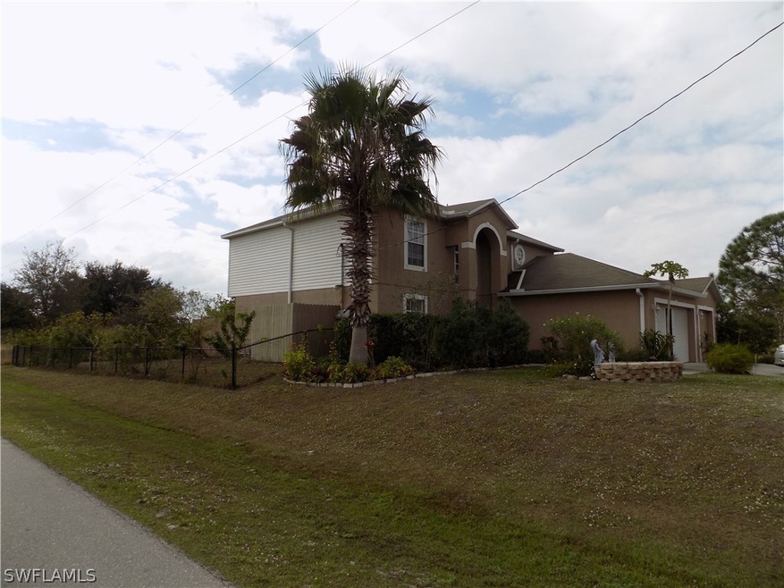 Large corner lot with fenced enclosed yard.