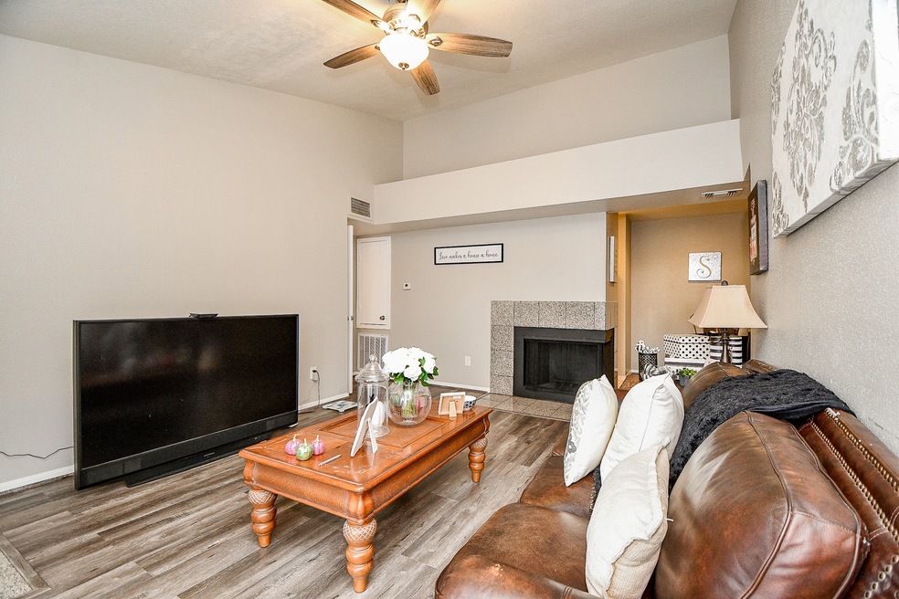 High ceiling, wood style flooring, double sided fi