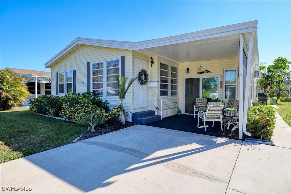 View of front of property featuring a carport and