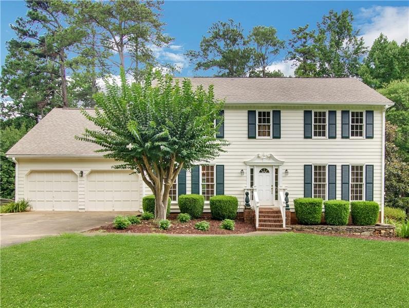 Curb appeal! Lovely, traditional home on over half