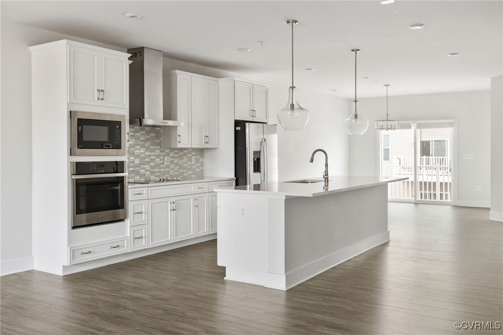 Kitchen featuring dark hardwood / wood-style floor