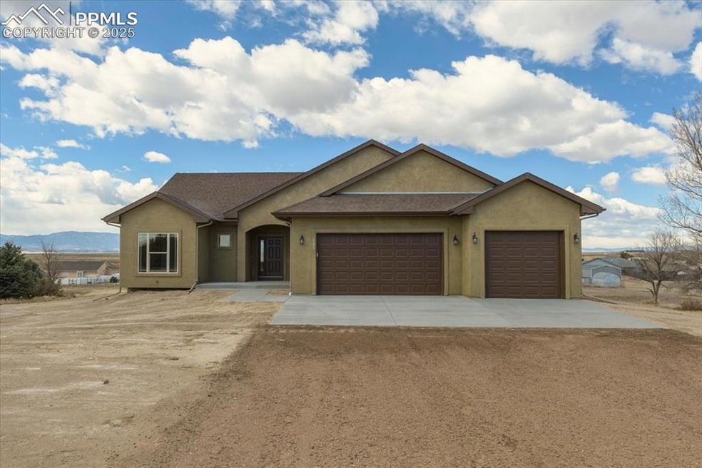 Single story home featuring concrete driveway, an 
