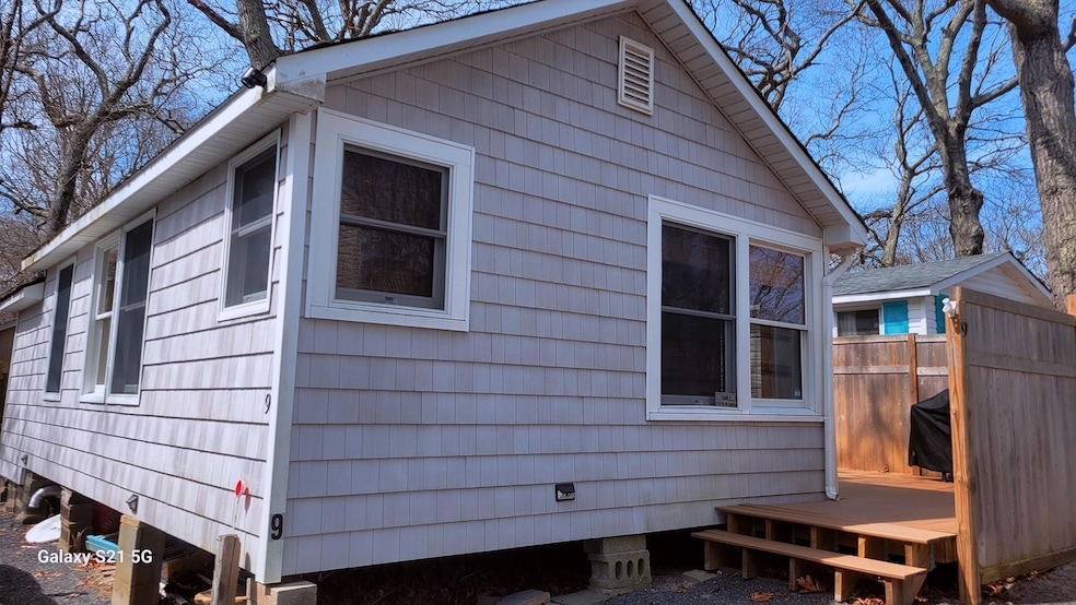 View of home's exterior featuring fence