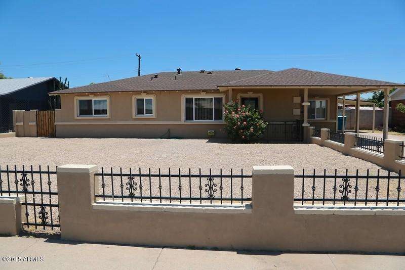 Front Stuccoed Brick & Wrought Iron Fron