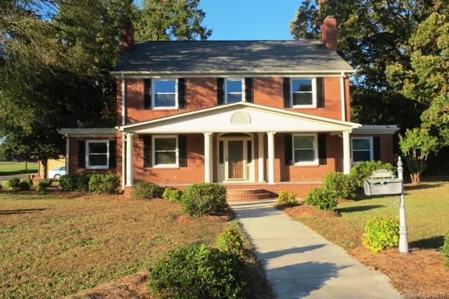 COVERED FRONT PORCH WITH STAMPED CONCRETE FLOOR & 