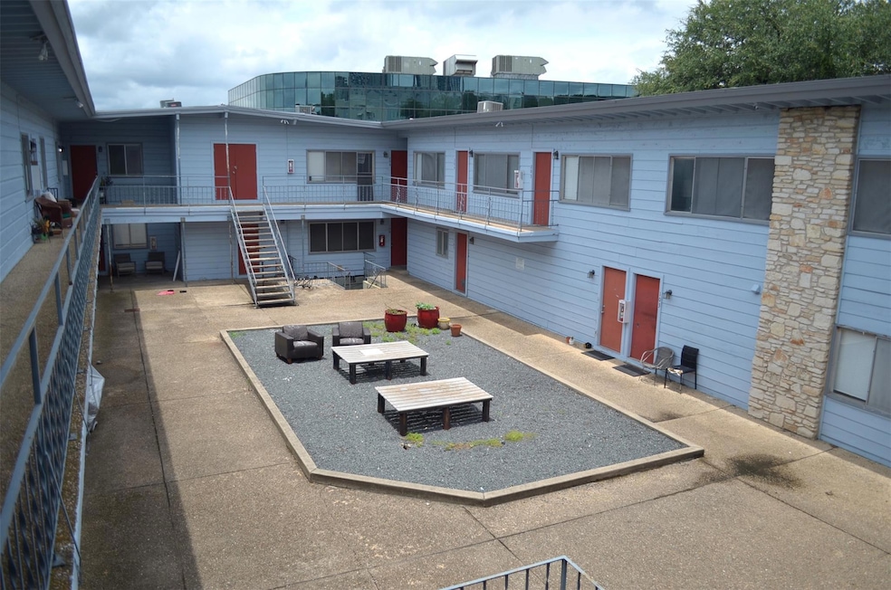 View of building exterior featuring stairway
