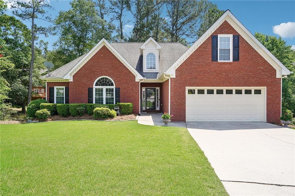 Traditional-style house with concrete driveway, a 