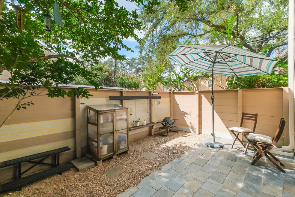 2125 Augusta Place offers a tranquil patio space framed by trees for added privacy.