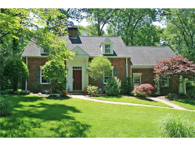 Exterior Front. Nestled in a 1-acre park-like sett