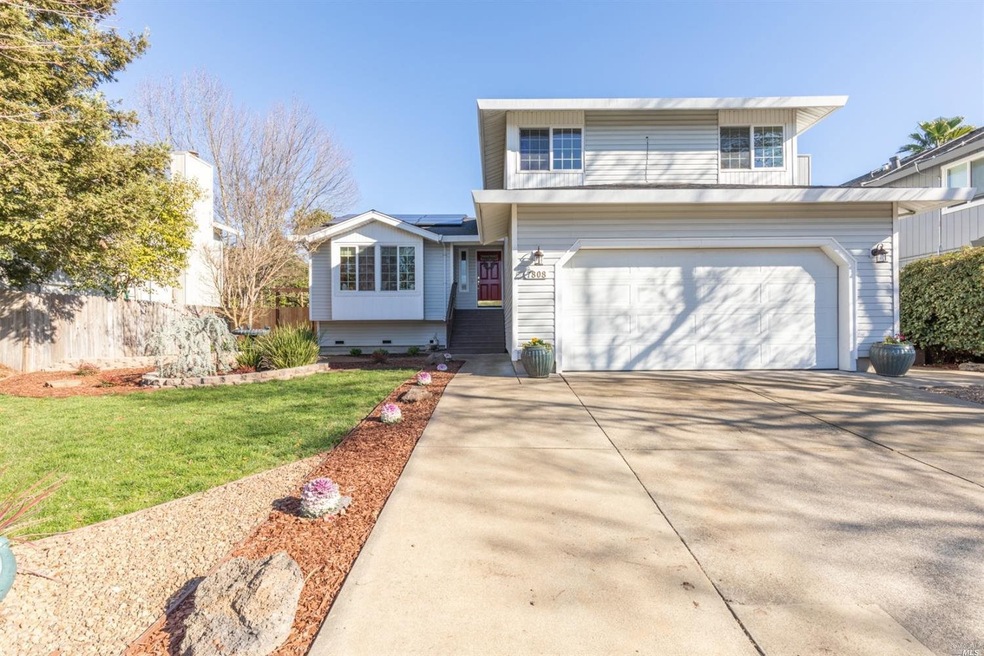 Good size driveway and fresh landscaping in the fr