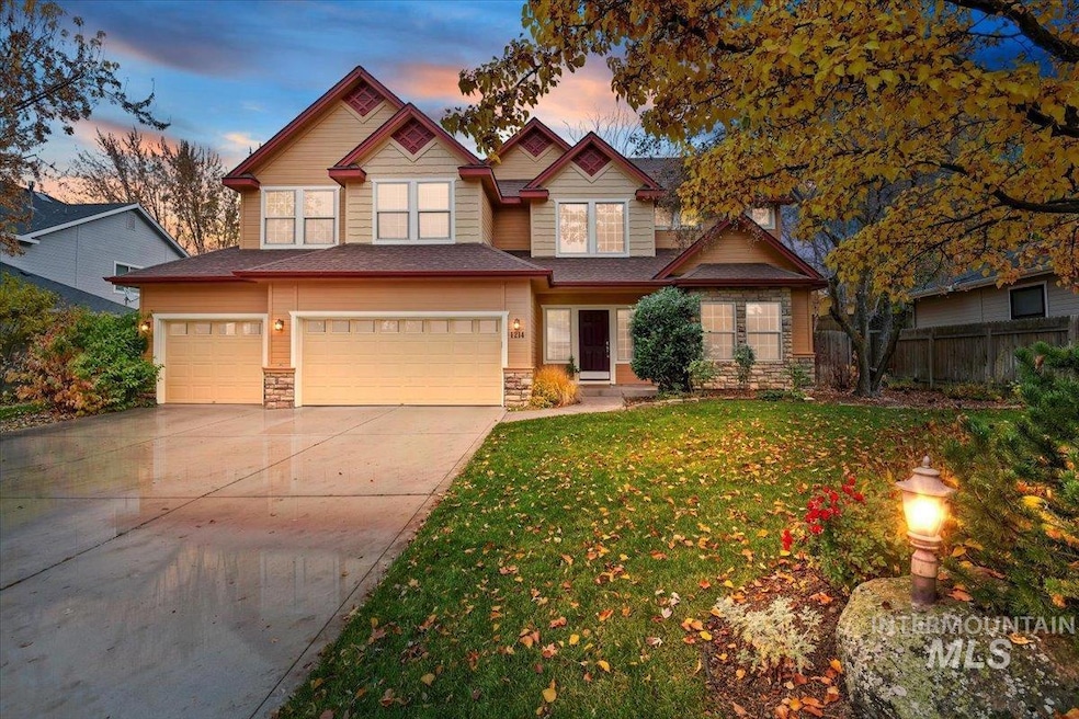 Craftsman inspired home featuring stone siding, concrete driveway, and a garage