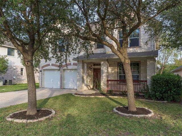 White limestone home in Scofield Ridge with front 