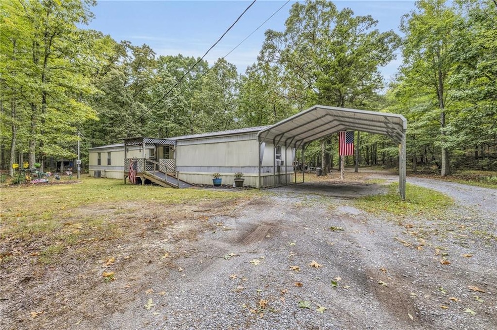 View of outbuilding with a carport