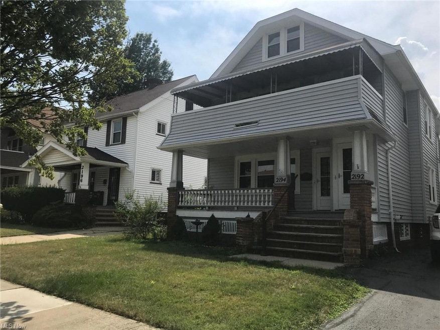 View of front of home with a front yard and a porch