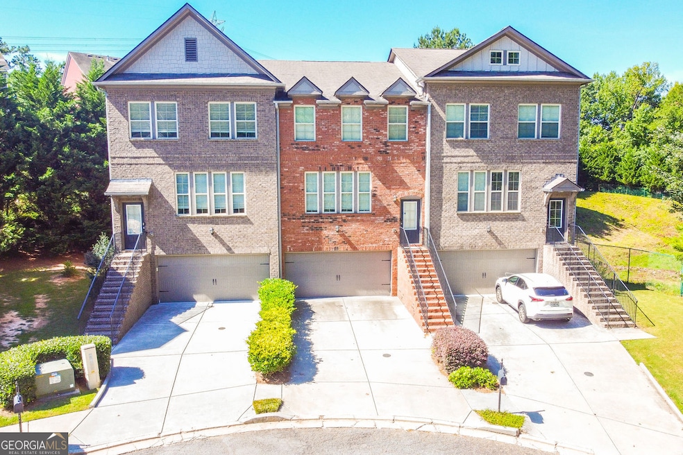Looking at the picture, property is the left end unit