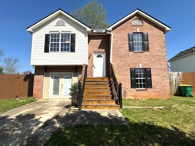 View of front of house with a front yard