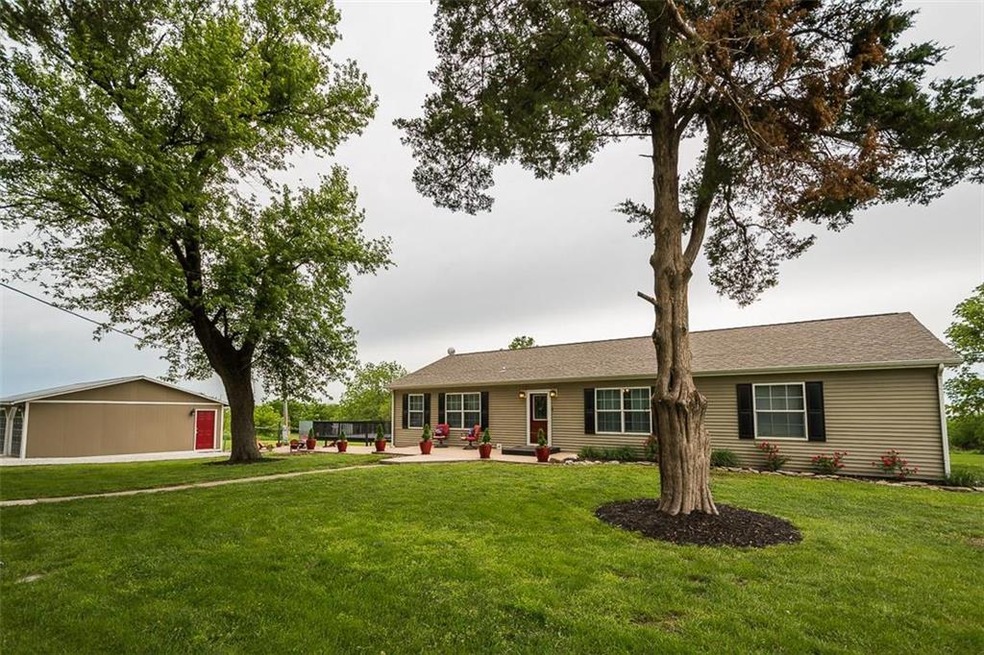 Ranch home with 2 car detached garage on 4.5 acres