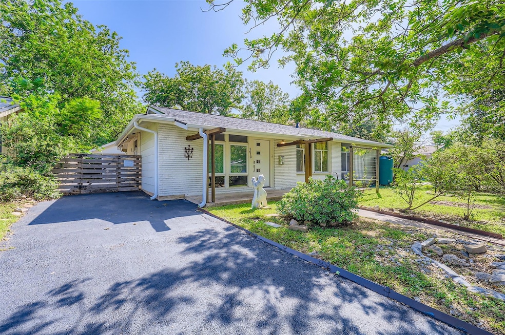 View of front of house with covered porch, drivew