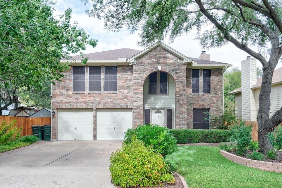 Traditional-style house featuring a garage, drive
