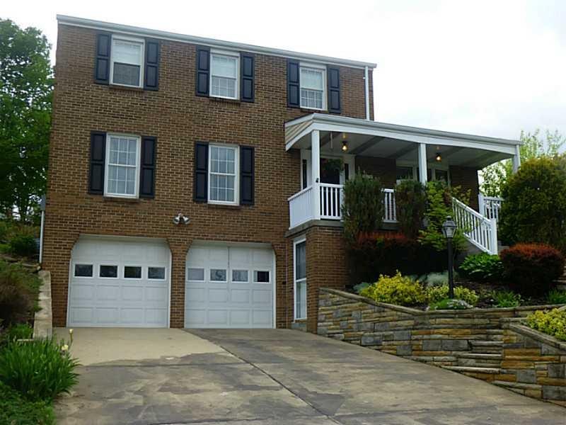 Exterior Front. Custom Full Brick Home