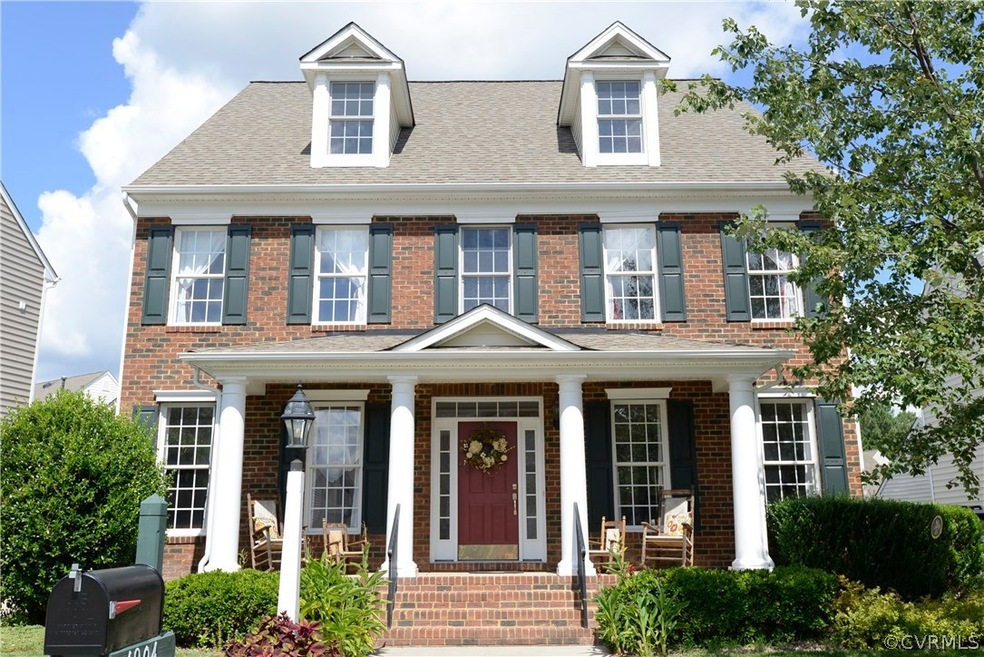 Gorgeous brick front home with vinyl siding on cul