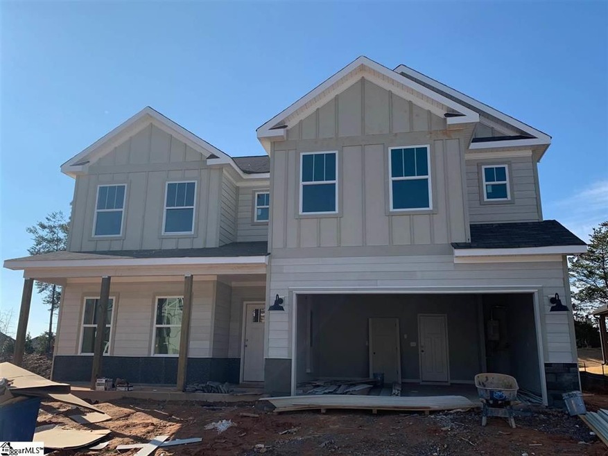 Cement board siding with stone water table and cov