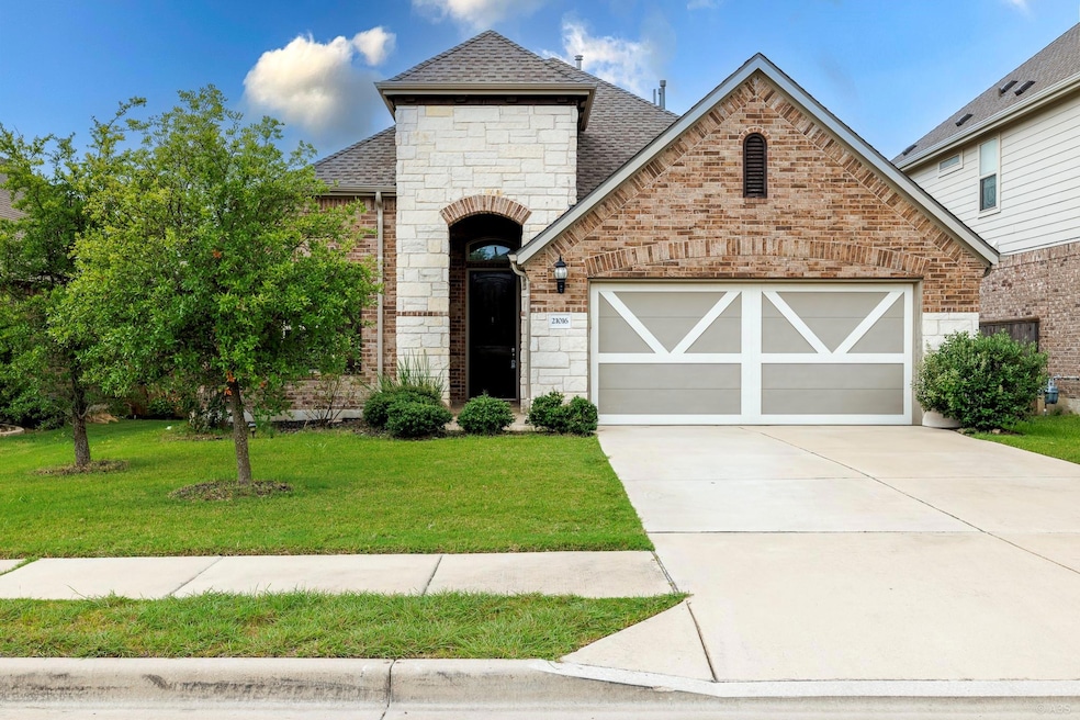 French country style house with roof with shingle