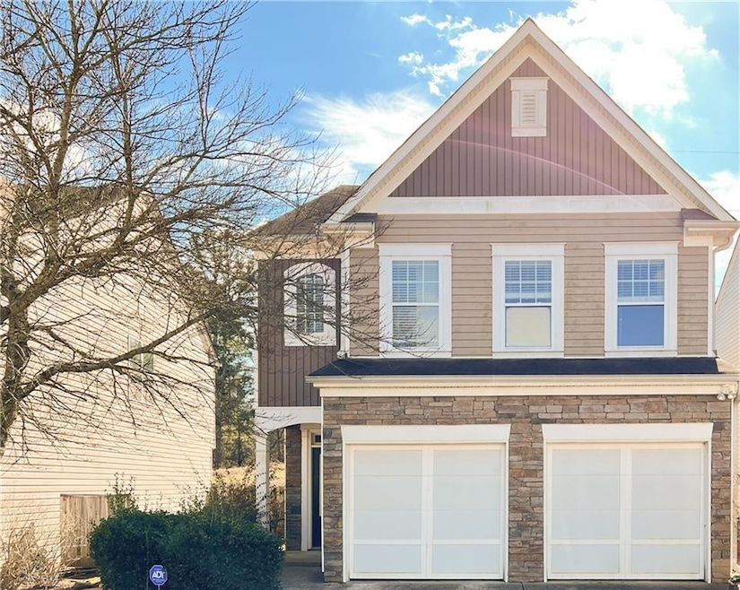 View of front facade featuring a garage