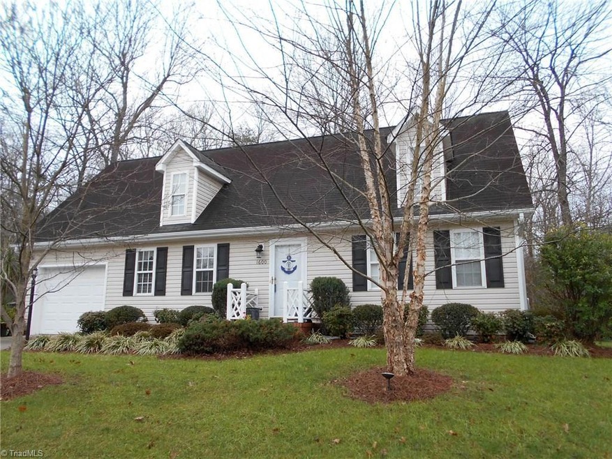 Front of home.  One car garage & paved drive.