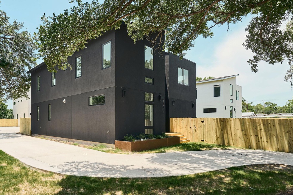 Back of property featuring stucco siding