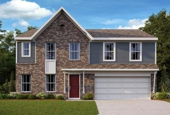 View of front of home featuring a garage and a fro