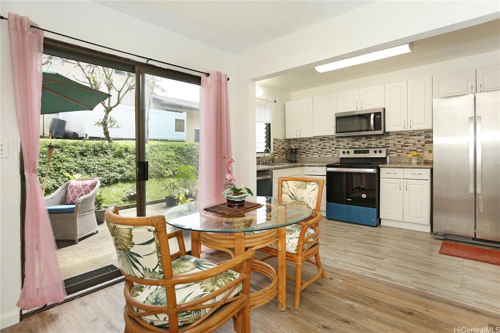 Open concept dining and kitchen area opens to spac