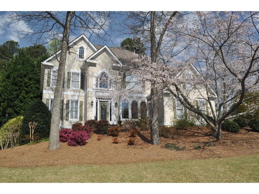 Gorgeous landscaping and private backyard, this be