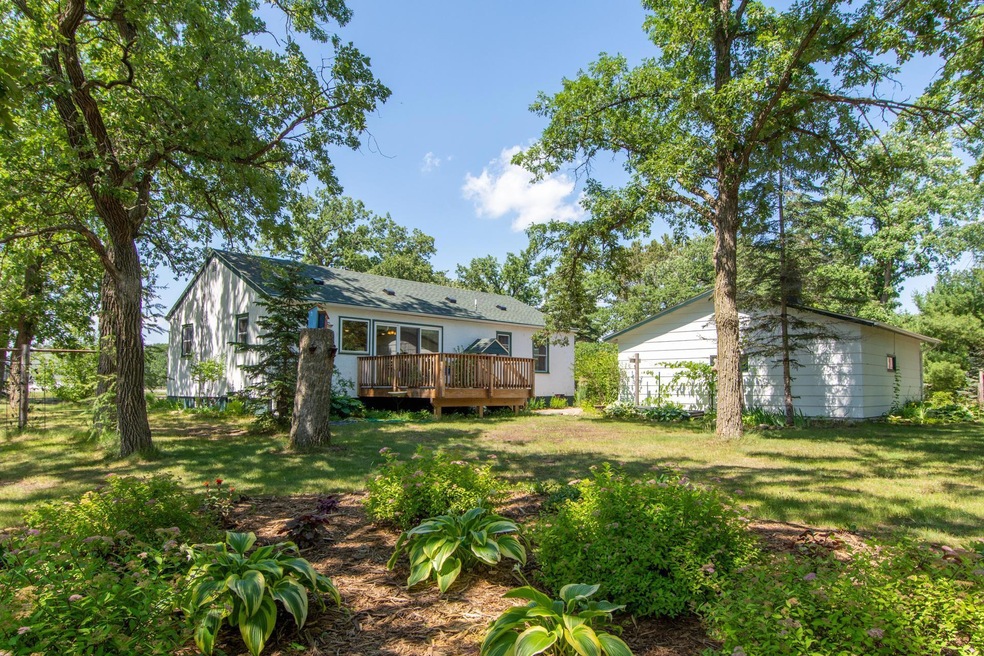 Welcome home!  The back yard features a lovely oversized perennial bed in the SE yard.