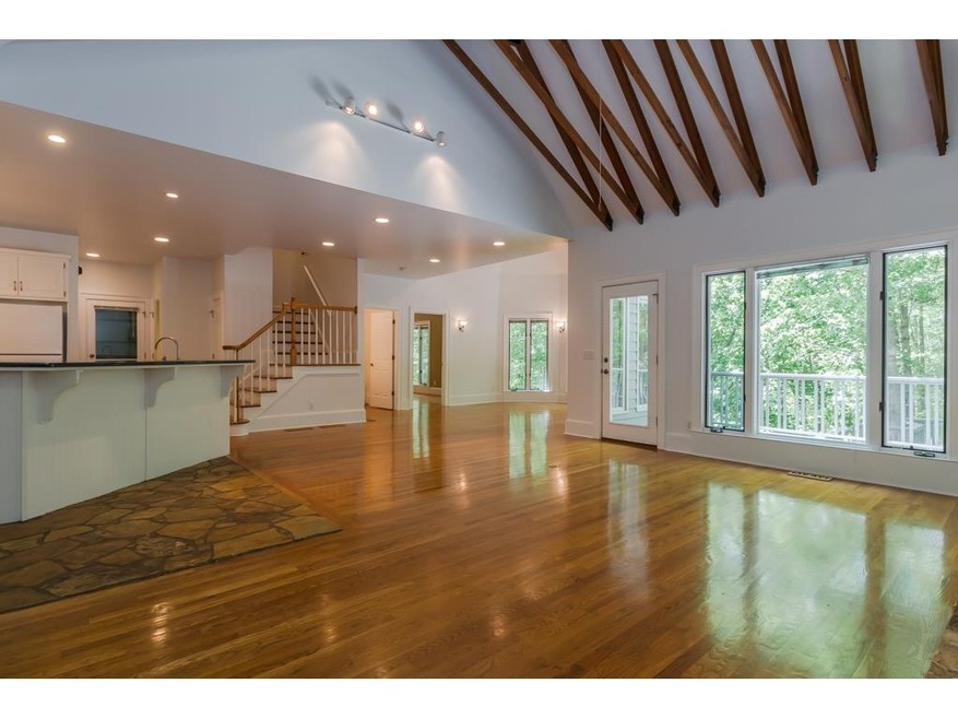 Bright open floor plan with gleaming hardwood floo