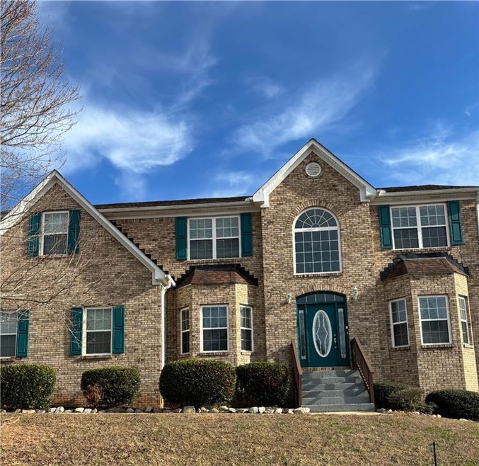 View of front of home with brick siding