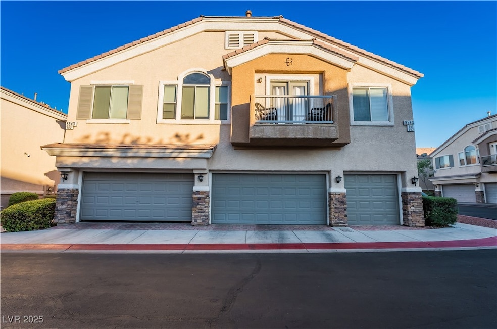 Multi unit property featuring a balcony, stucco si
