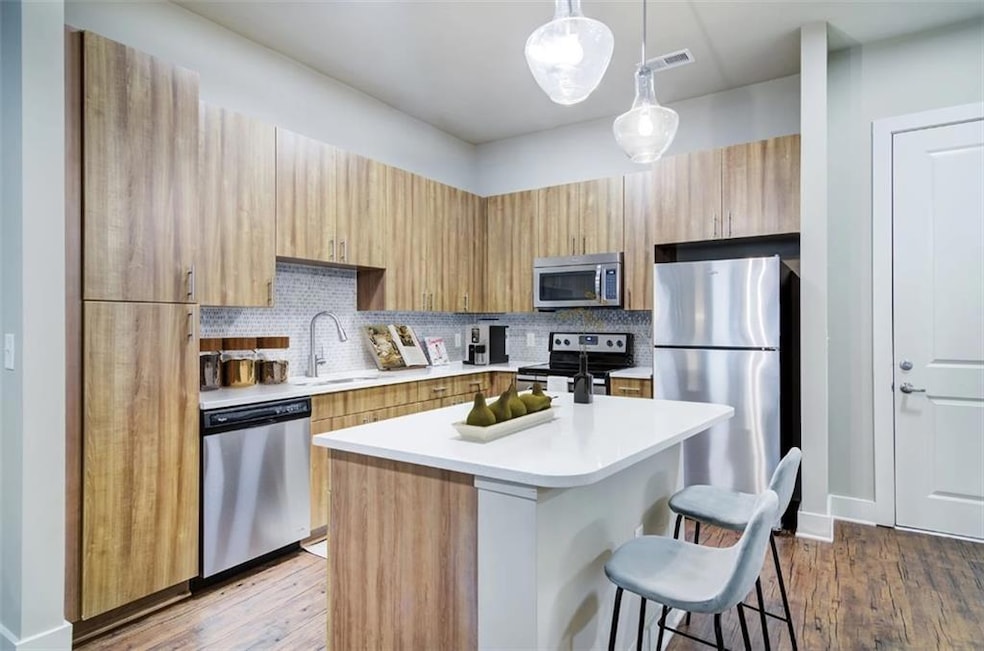 Kitchen with decorative light fixtures, hardwood /