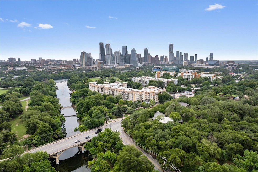 Aerial view of skyline, a notable bridge, and a n