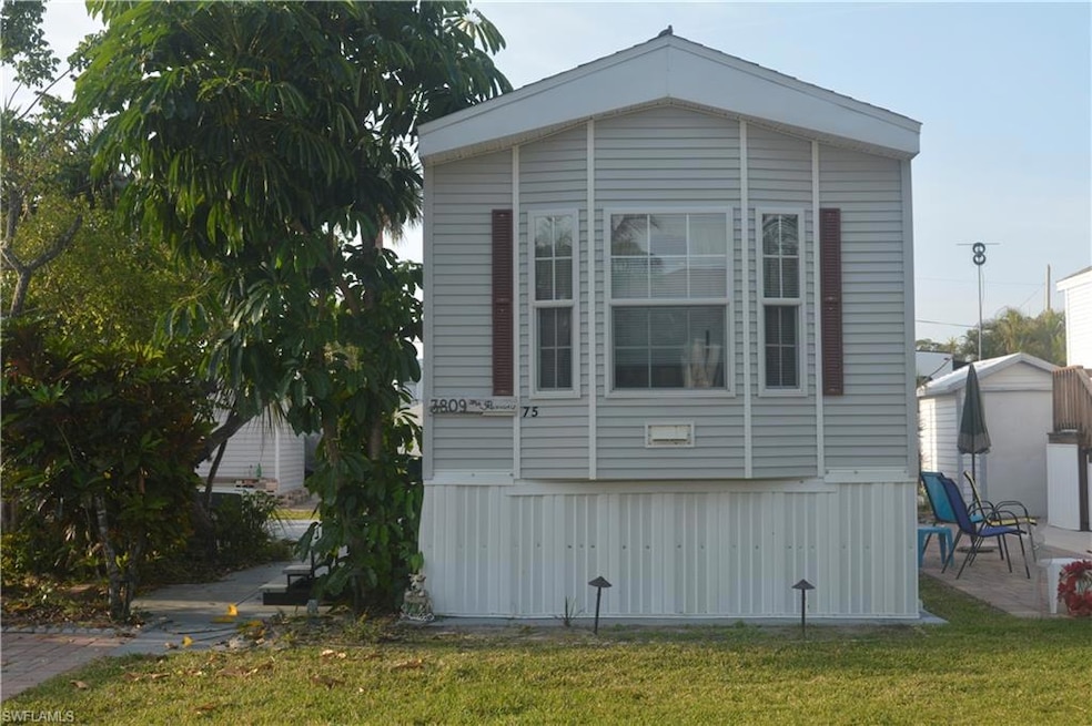 View of home's exterior featuring a lawn and a pat