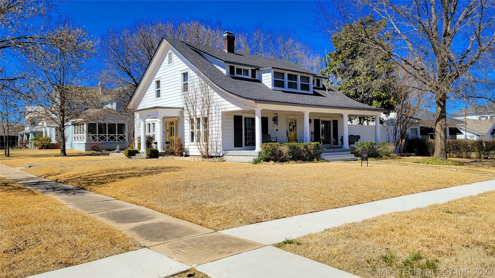 This lovely centennial home sits on a large corner