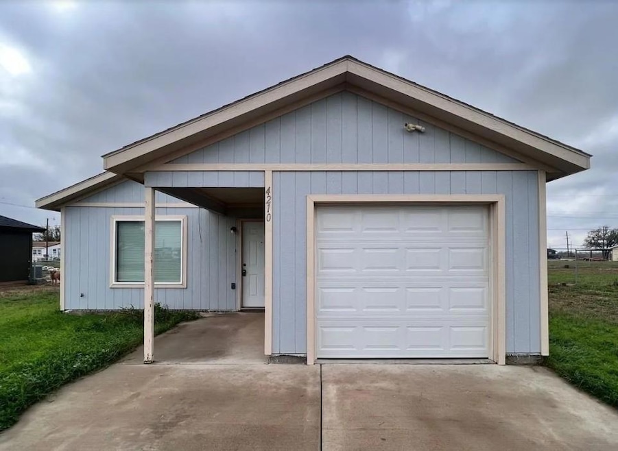 Garage with concrete driveway